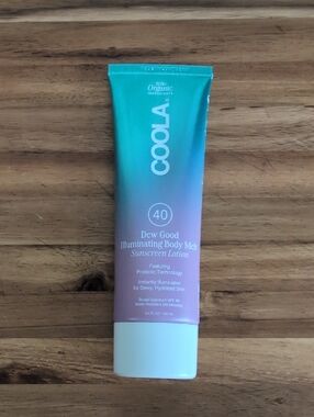 COOLA Dew Good Illuminating Body Melt SPF 40 - Teal and Pink Tube